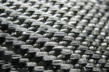 Fototapeta premium Carbon close-up. Carbon fiber close-up shot. Carbon fiber weaving. Modern carbon materials. Super light materials for building and tuning cars.