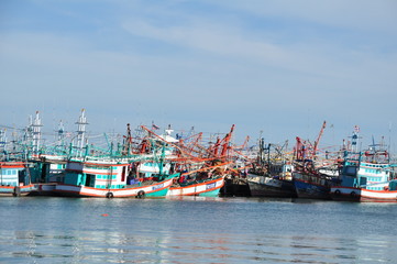 Obraz premium View of Thai fishing port on a clear bright day.
