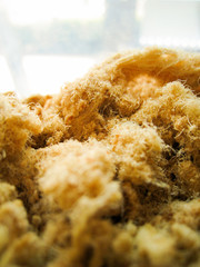 close-up of shredded dried pork look like fur or mountain of brown fur