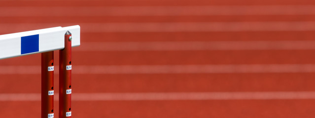 hurdle on the red running track prepared for competition