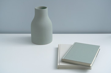 Minimalist book notebook and a plain vase 