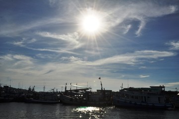 Obraz premium View of Thai fishing port on a clear bright day.