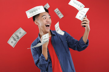 Young Asian teenager doing winning gesture, Happy get special gift online