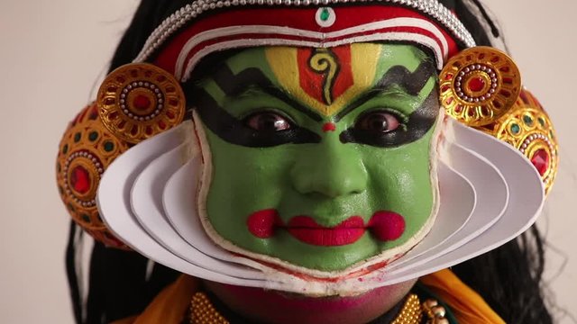 Close up of a Kathakali dancer expressing Sringara through his eyes.  