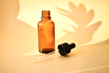  osmetic bottles on the bed background, with contrasting shadows, organic product, Alternative medicine. Copy space.