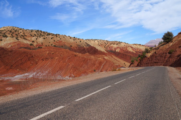 Road through High Atlas Mountains with geologic layers of salt, Morocco