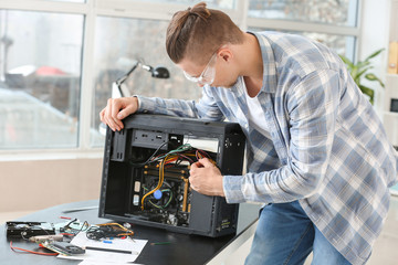 Electronic technician working in service center