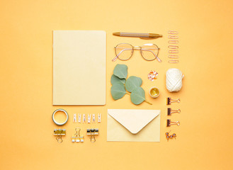 Set of school supplies with eyeglasses on color background