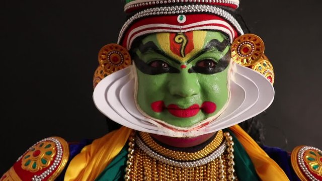 Kathakali dancer giving an expression with his eyes. 