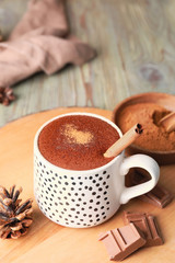 Cup of hot chocolate on wooden table