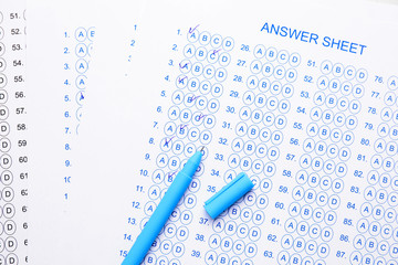 Answer sheet forms with pen. Concept of passing exam