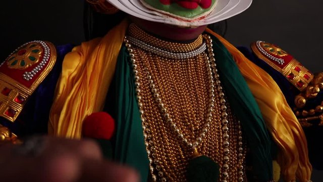 Kathakali dancer performing an act with his eyes and fingers. 