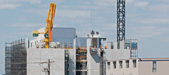 Building series. Current floor building activities on the Multistory building under construction....