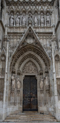 Door or gate of Neo-Gothic Votive Church (Votivkirche) on Ringstrasse - second-tallest church in Vienna, Austria. Church consecrated in 1879 on occasion of Imperial Couple's Silver Wedding.
