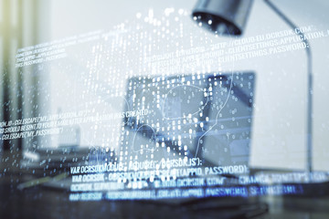 Double exposure of creative code skull hologram on laptop background. Malware and cyber crime concept