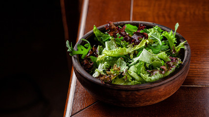 Raw food concept. A plate with fresh salad is on the table. background image, copy space text