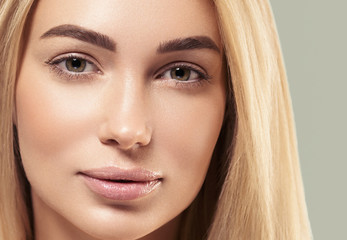 Fototapeta premium Beautiful face woman with long blonde smooth hair healthy skin natural fashion make up
