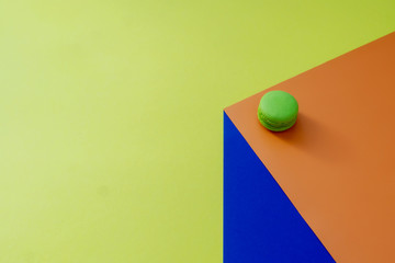 Green macaroon on 3D background.