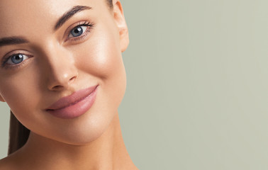 Fototapeta premium Woman beautiful face happy smile natural make up fresh clean skin beauty