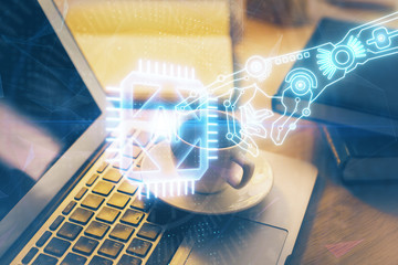 Double exposure of desktop computer and technology theme hologram. Concept of software development.
