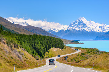 The road curves along Lake Pukaki and Mount Cook on a clear day at Peter's Lookout in the South...