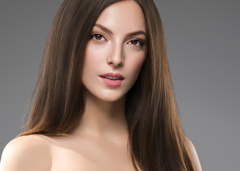Fototapeta premium Beautiful female face healthy natural skin fashion make up brunette smooth hair woman spa cosmetic portrait
