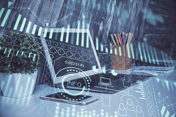 Computer on desktop in office with technology theme hologram. Multi exposure. Tech concept.