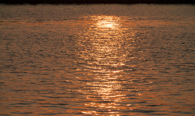 sunset light reflecting on water