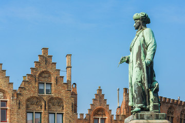 Statue of the Flemish painter Jan van Eyck in Bruges, Belgium