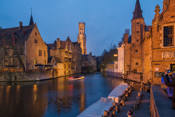 Fototapeta na wymiar Panoramic city view with Belfry tower and famous canal in Bruges, Belgium.
