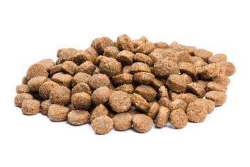 Dry cat food isolated on white background close-up top view