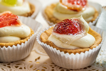 Cakes with cream, chocolate and fruit