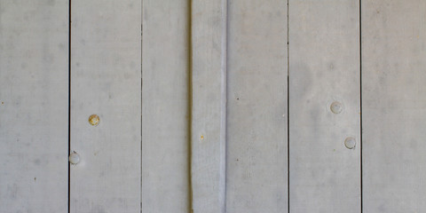Grey background of weathered old painted boards wooden plank