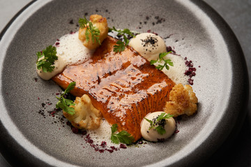 Baked salmon fish fillet with chinese cauliflower and cream sauce