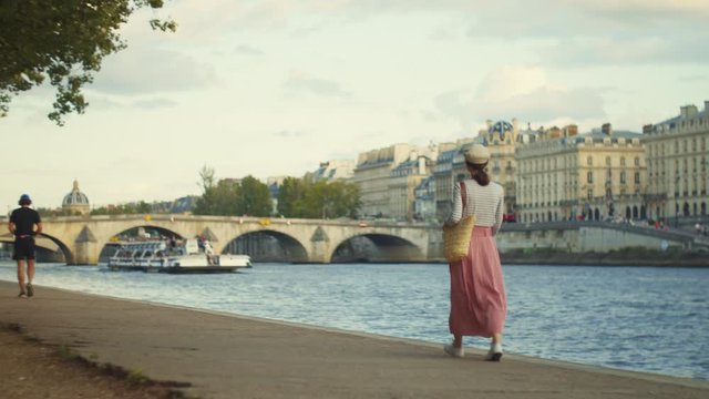 Young tourist walking along the promenade in Paris
