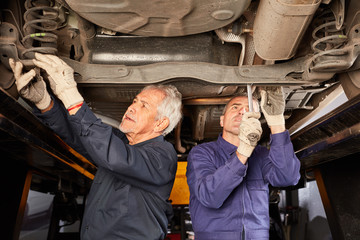 Mechanic at the car repair in workshop