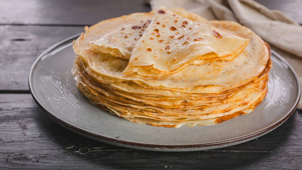 Food banner. Stack of pancakes on a plate. Slavic national holiday Maslenitsa. Close-up