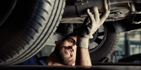 Mechatronics engineer examining emissions at the exhaust