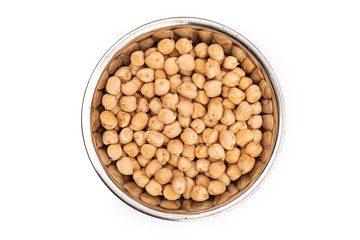 Dried Chickpeas from above in a stainless steel bowl,isolated on a white background. Healthy ingredient used in soups and casseroles. Naturally preserved legumes with long shelf life.