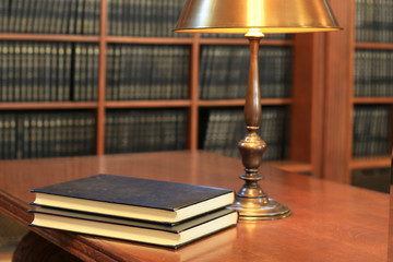 Books are on the table in the library