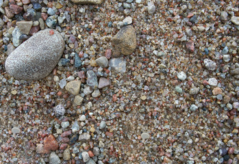Smooth pebble stones on summer beach. Natural design background