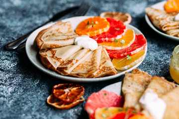 pancakes with citrus on a plate