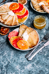pancakes with citrus on a plate
