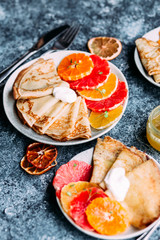 pancakes with citrus on a plate