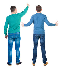 Back view two man in sweater showing thumb up.