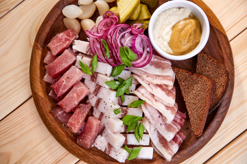 meat appetizer on the wooden background