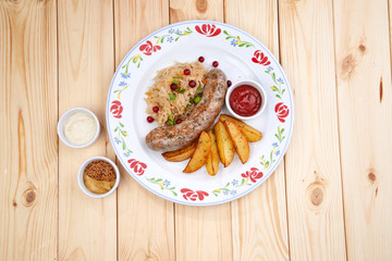 sausage with baked potatoes, top view
