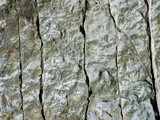 Texture, background layers and cracks in sedimentary rock on cliff face. Cliff of rock mountain....