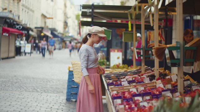 Attractive girl in the food market in France