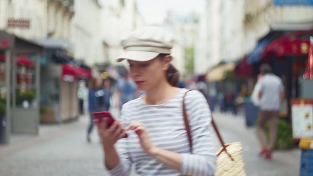 Attractive girl with a phone in France